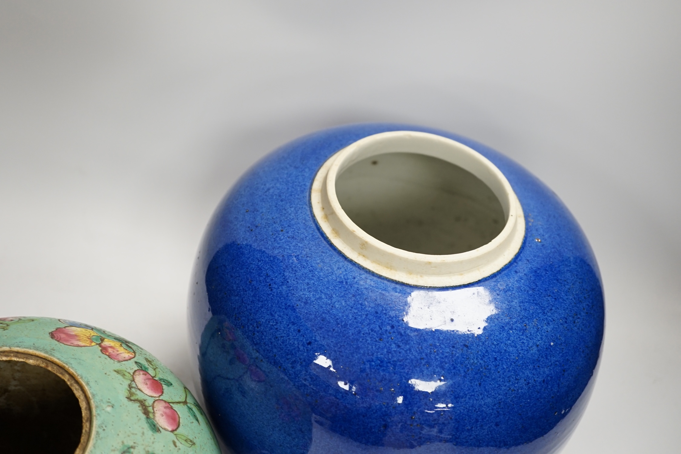 A Chinese powder blue jar, late 19th century, drilled hole to base and a turquoise glazed ground jar, blue vase 22cm high. Condition - turquoise jar cracked and chipped
